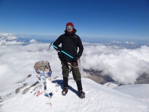 Ben S. on top of Mt. Elbrus wearing 40 Below K2 Superlight overboots